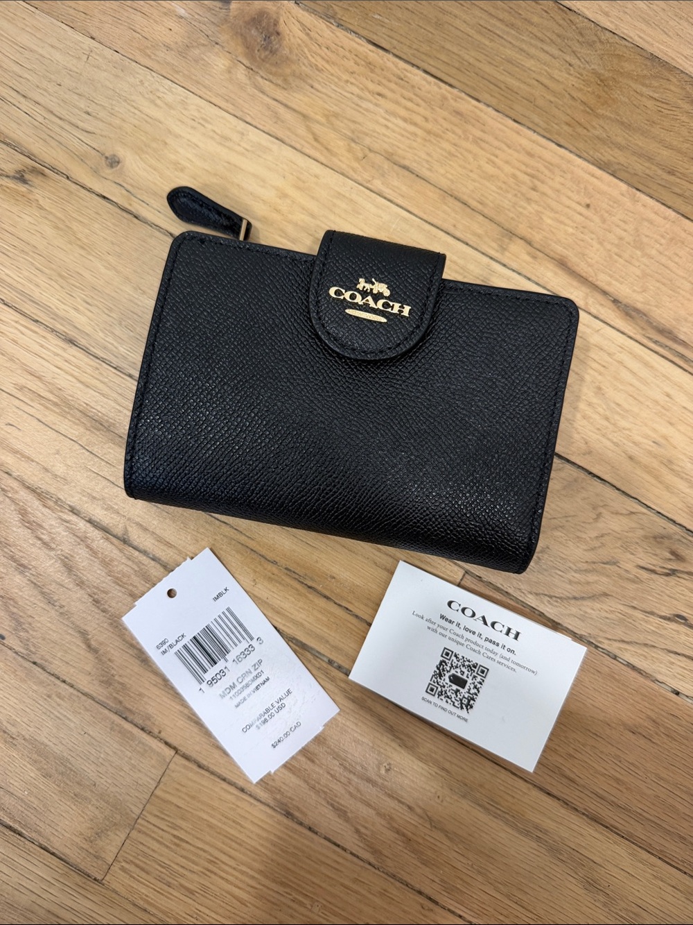 Coach Black Pebbled Leather Wallet with Gold Logo Accent